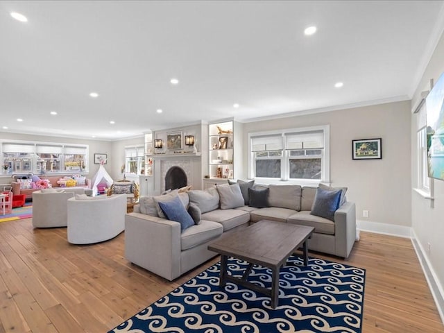 572 Jerusalem Rd, Cohasset, MA 02025 - living room with crown molding, wood-type flooring, recessed lighting, a fireplace, and baseboards