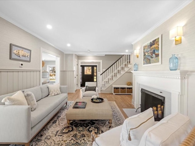 572 Jerusalem Rd, Cohasset, MA 02025 - living room with ornamental molding, wood finished floors, a fireplace with flush hearth, recessed lighting, and stairway