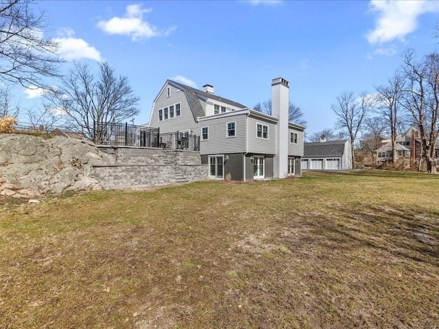 572 Jerusalem Rd, Cohasset, MA 02025 - rear view of house with a chimney, a lawn, and a gambrel roof