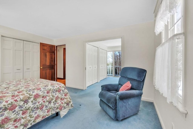 carpeted bedroom featuring baseboards