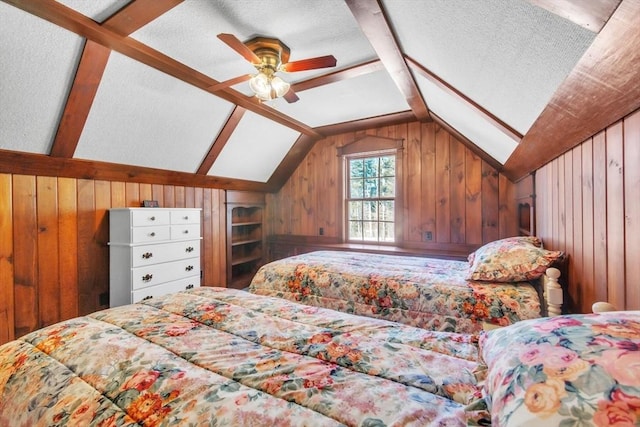 bedroom with vaulted ceiling, wooden walls, and a textured ceiling