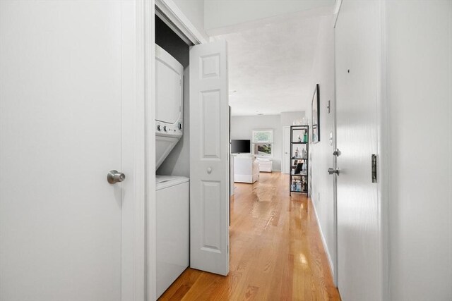 162 Willow Rd Unit 11, Nahant, MA 01908 - laundry area featuring stacked washer / dryer and light wood-type flooring
