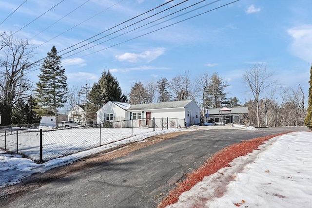 view of front of house with a fenced front yard and driveway