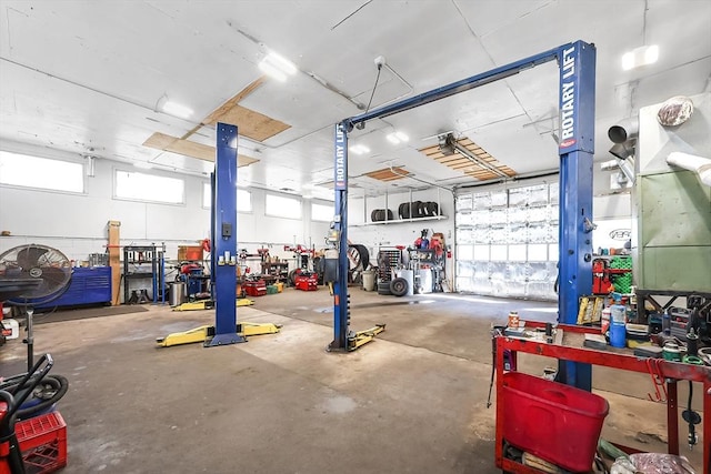 garage featuring a workshop area and a garage door opener