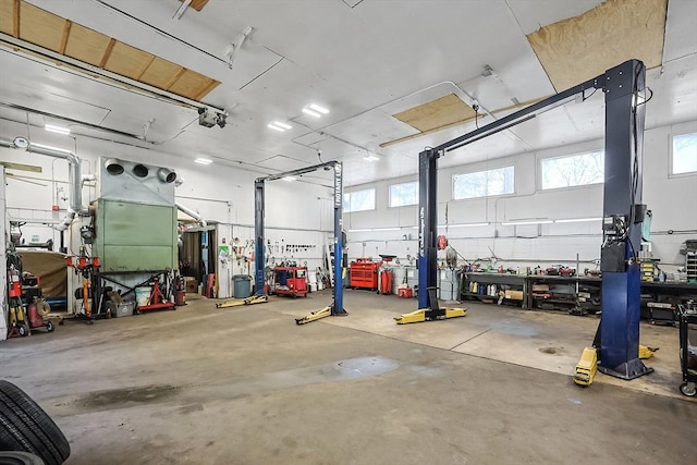 garage featuring a workshop area and a garage door opener