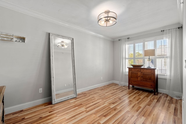 bedroom featuring ornamental molding and light hardwood / wood-style floors