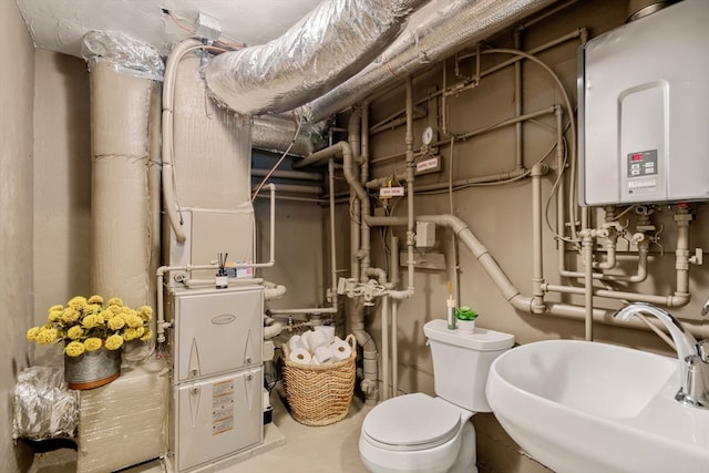 utility room with sink and water heater