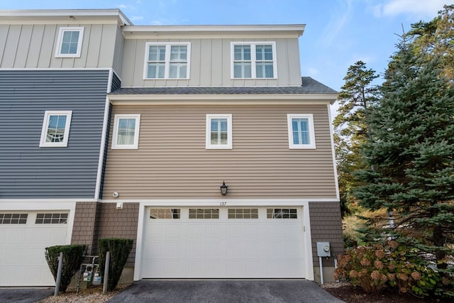 view of side of property featuring a garage