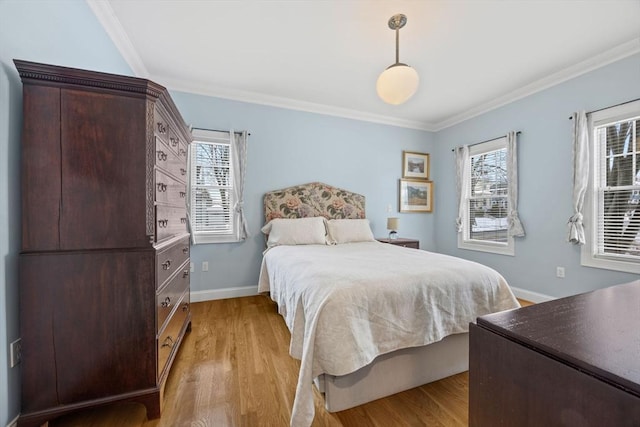 bedroom with multiple windows, ornamental molding, and light wood-type flooring