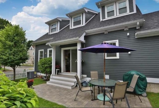 rear view of house featuring a patio area and central AC unit