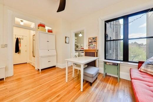 interior space with light wood-style flooring and ceiling fan