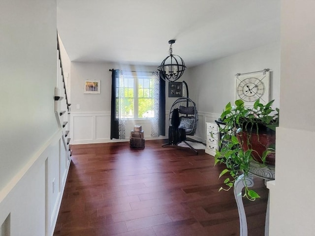 391 Gibbs St, Fall River, MA 02720 - foyer entrance featuring a decorative wall, a chandelier, dark wood-style floors, and a wainscoted wall