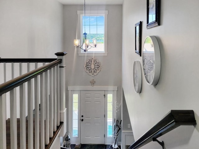 391 Gibbs St, Fall River, MA 02720 - foyer featuring a high ceiling, a chandelier, healthy amount of natural light, and stairs