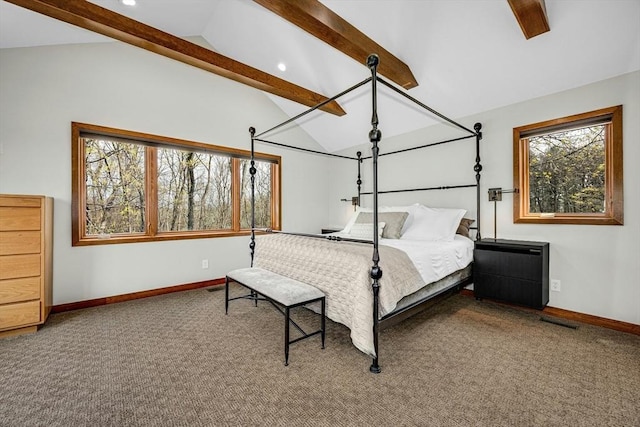 bedroom featuring multiple windows, lofted ceiling with beams, and carpet floors