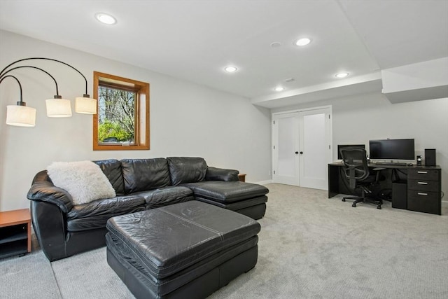 carpeted living area featuring recessed lighting and french doors