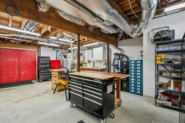 unfinished basement with a workshop area