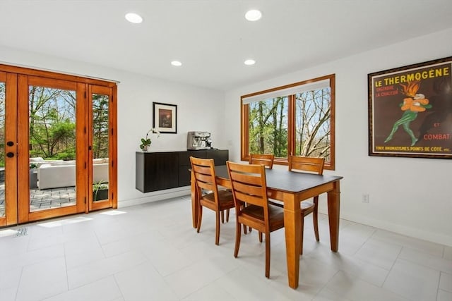 dining area with recessed lighting and baseboards