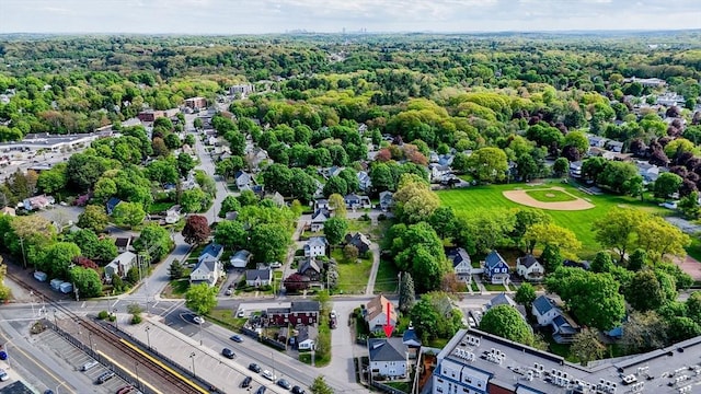 aerial perspective of suburban area featuring a forest