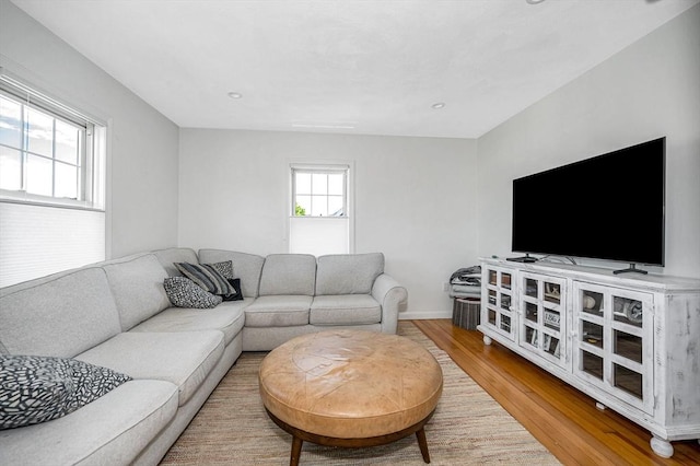 living area featuring wood finished floors and baseboards
