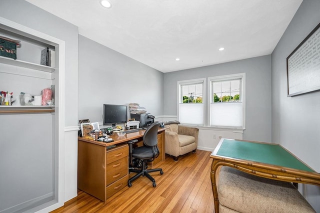 office space featuring light wood-type flooring and recessed lighting