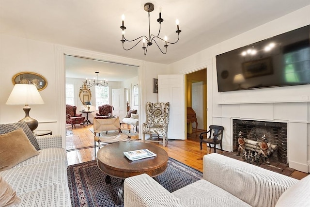 9 The Cmn, Royalston, MA 01368 - living room with a chandelier, hardwood / wood-style floors, and a tiled fireplace