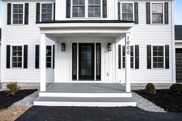 doorway to property with covered porch