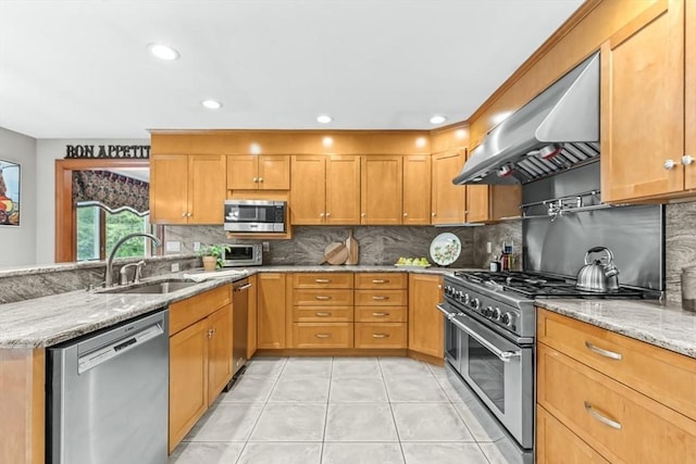 18 Sumac St, Billerica, MA 01821 - kitchen with stainless steel appliances, under cabinet range hood, a sink, light stone counters, and backsplash