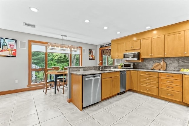 18 Sumac St, Billerica, MA 01821 - kitchen with appliances with stainless steel finishes, decorative backsplash, a sink, recessed lighting, and light stone countertops