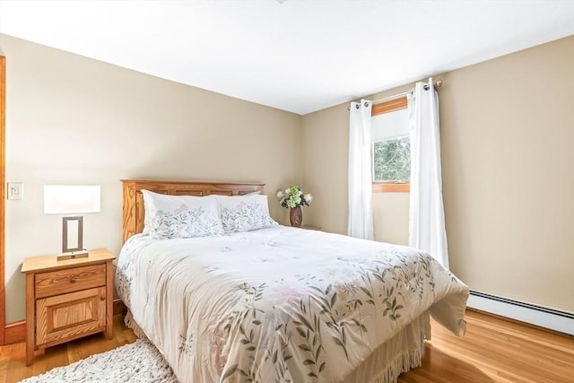 18 Sumac St, Billerica, MA 01821 - bedroom with a baseboard radiator and light wood finished floors