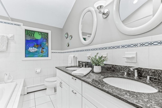 18 Sumac St, Billerica, MA 01821 - full bath with a baseboard heating unit, tile walls, double vanity, tile patterned floors, and toilet