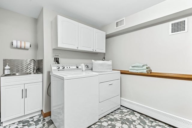18 Sumac St, Billerica, MA 01821 - laundry room featuring a baseboard heating unit, cabinet space, washer and clothes dryer, and baseboards