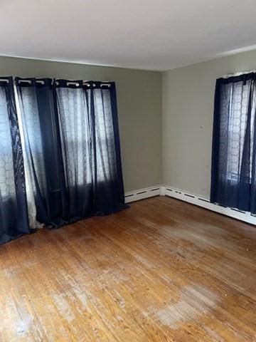 spare room with hardwood / wood-style flooring