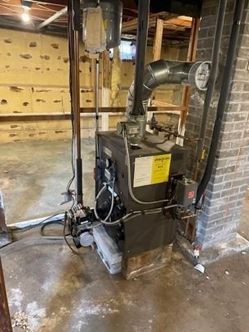 utility room featuring a heating unit