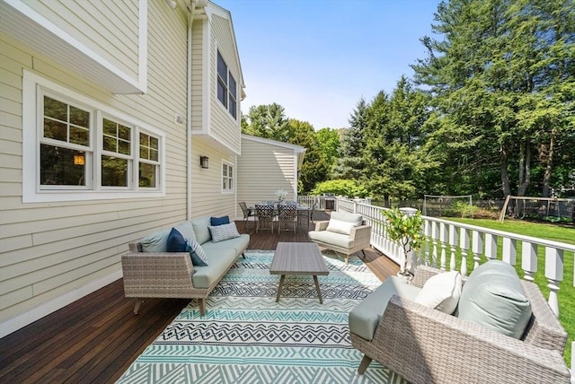 wooden terrace with an outdoor hangout area and outdoor dining area