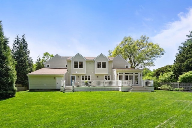 back of property with a wooden deck