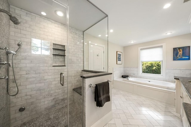 full bathroom with a shower stall, recessed lighting, vanity, a garden tub, and tile patterned flooring