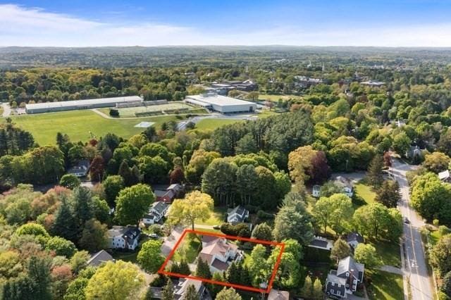 view of property location with property parcel outlined and a heavily wooded area