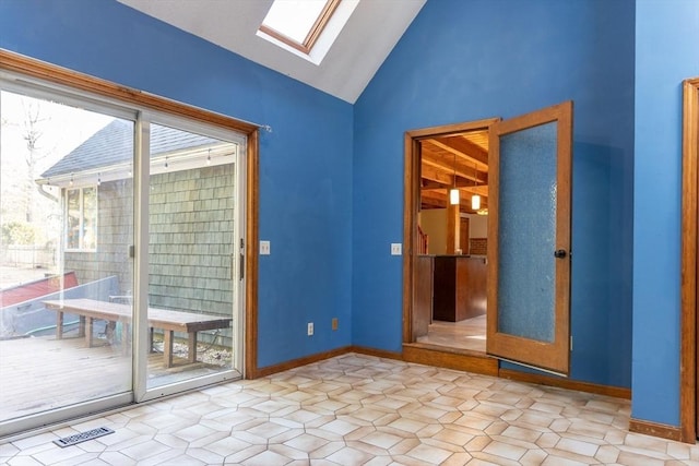 doorway to outside featuring visible vents, lofted ceiling with skylight, and baseboards