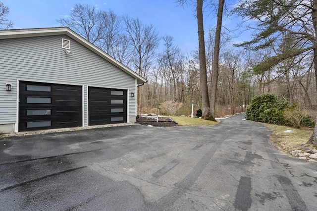 garage featuring driveway