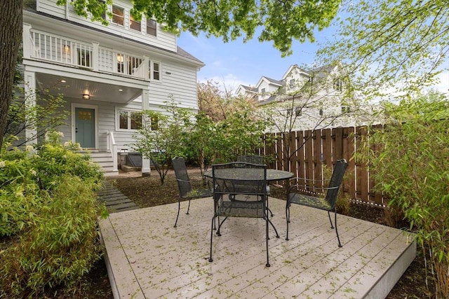 view of patio with fence and outdoor dining space