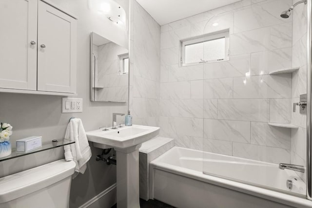 bathroom with toilet and tub / shower combination