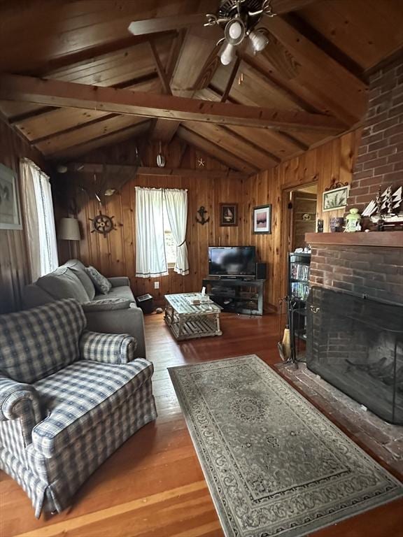 16 Neds Way, Plymouth, MA 02360 - living area with ceiling fan, wood finished floors, wood walls, a fireplace, and wooden ceiling