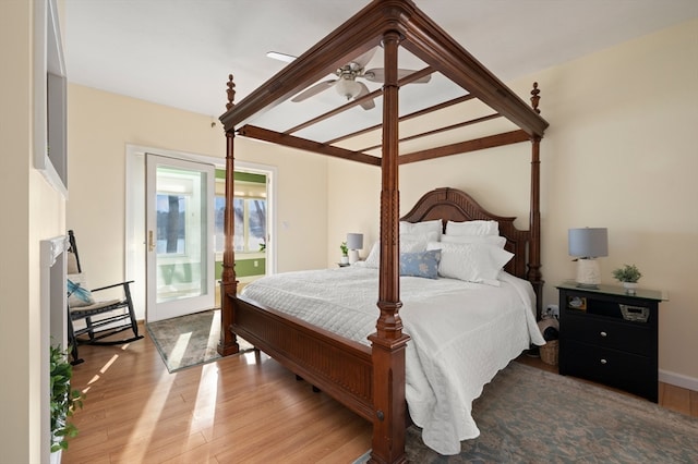 bedroom with wood-type flooring and ceiling fan