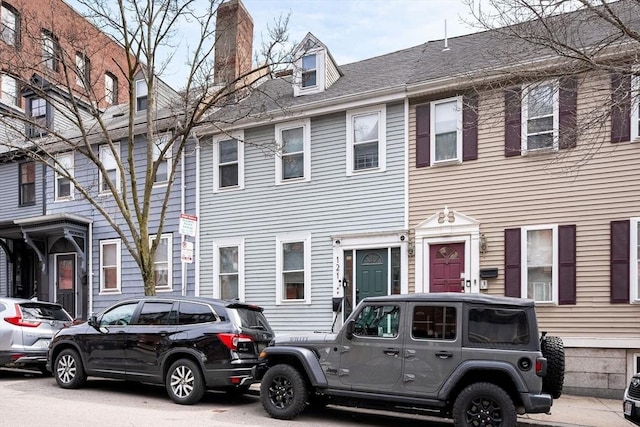 multi unit property featuring a chimney