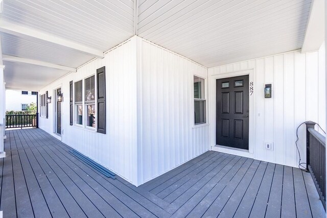 wooden deck featuring covered porch