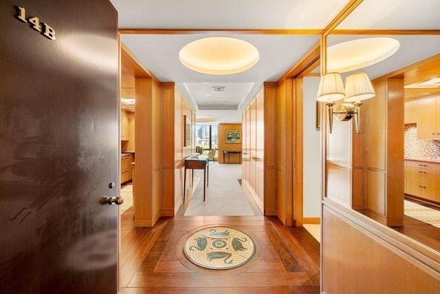 2 Commonwealth Ave Unit 14B, Boston, MA 02116 - hall with baseboards, a tray ceiling, and light wood-type flooring