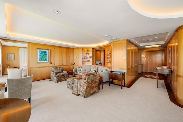 2 Commonwealth Ave Unit 14B, Boston, MA 02116 - living area with visible vents, a tray ceiling, and light carpet
