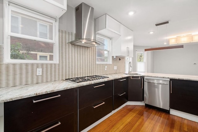 117 Sycamore St Unit 1, Boston, MA 02131 - kitchen featuring stainless steel appliances, wall chimney exhaust hood, a sink, modern cabinets, and hardwood / wood-style floors