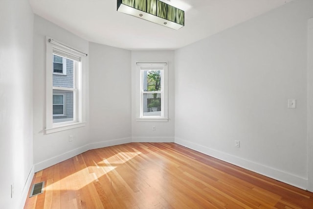 117 Sycamore St Unit 1, Boston, MA 02131 - empty room with light wood-type flooring and baseboards