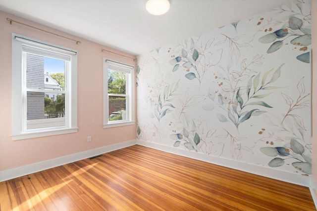 117 Sycamore St Unit 1, Boston, MA 02131 - unfurnished room featuring baseboards and light wood finished floors